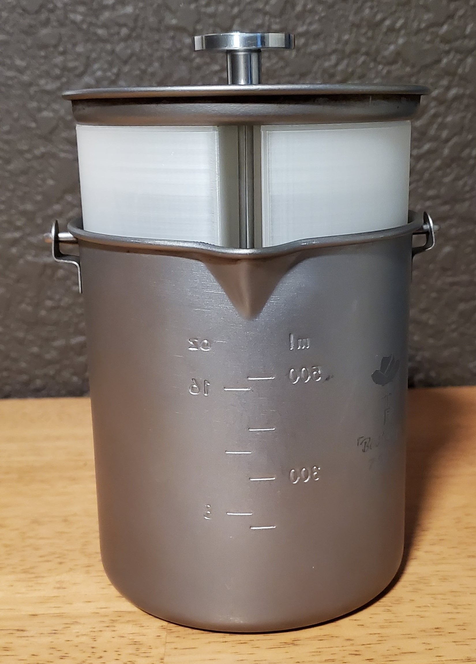 Bestargot titanium french press showing Camel Joe being inserted